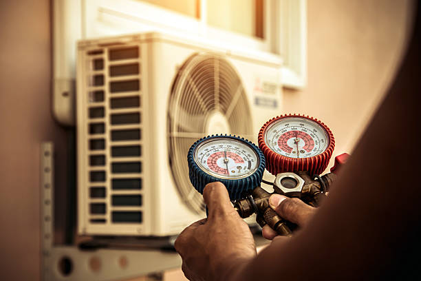 Professional Heat Pump Repair technician working in San Carlos, AZ